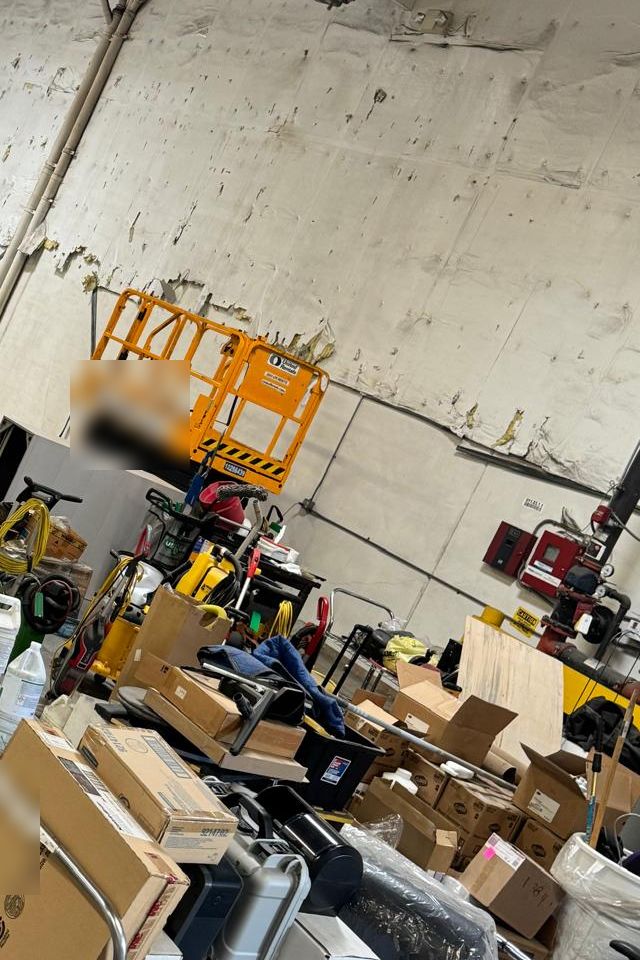 Equipment and materials staged for hauling during a warehouse cleanout